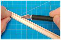 Auseinanderschneiden der beklebten Leisten