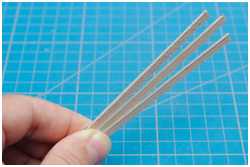 mit Pappe beklebte Leisten