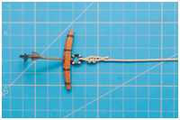 Kneifbändsel nach dem Anknoten des Ankertaus