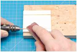 dünne Rundhölzer schleifen