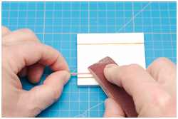 dünne Rundhölzer schleifen